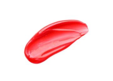 Photo of Red lip gloss isolated on white, top view. Sample of cosmetic product