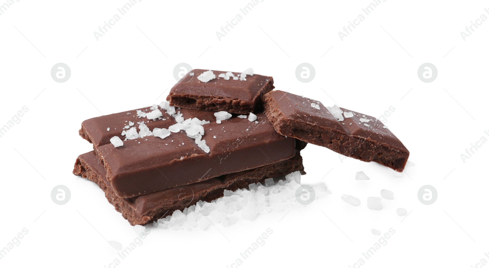 Photo of Pieces of chocolate with salt isolated on white