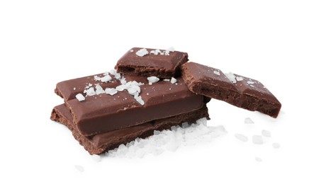 Photo of Pieces of chocolate with salt isolated on white