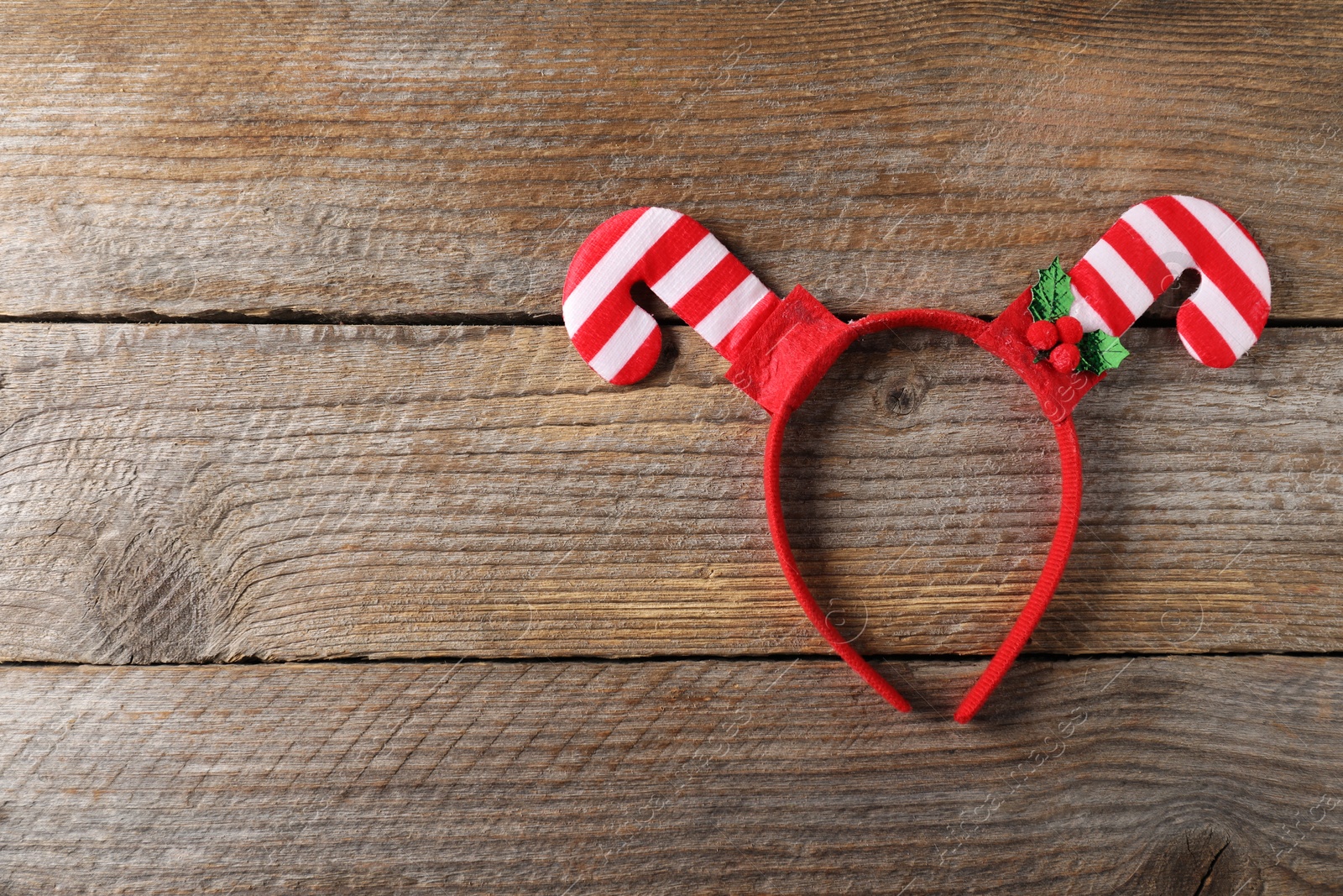 Photo of Stylish party headband on wooden background, top view with space for text. Christmas accessory