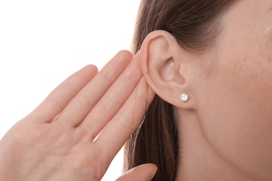 Photo of Woman showing hand to ear gesture on white background, closeup