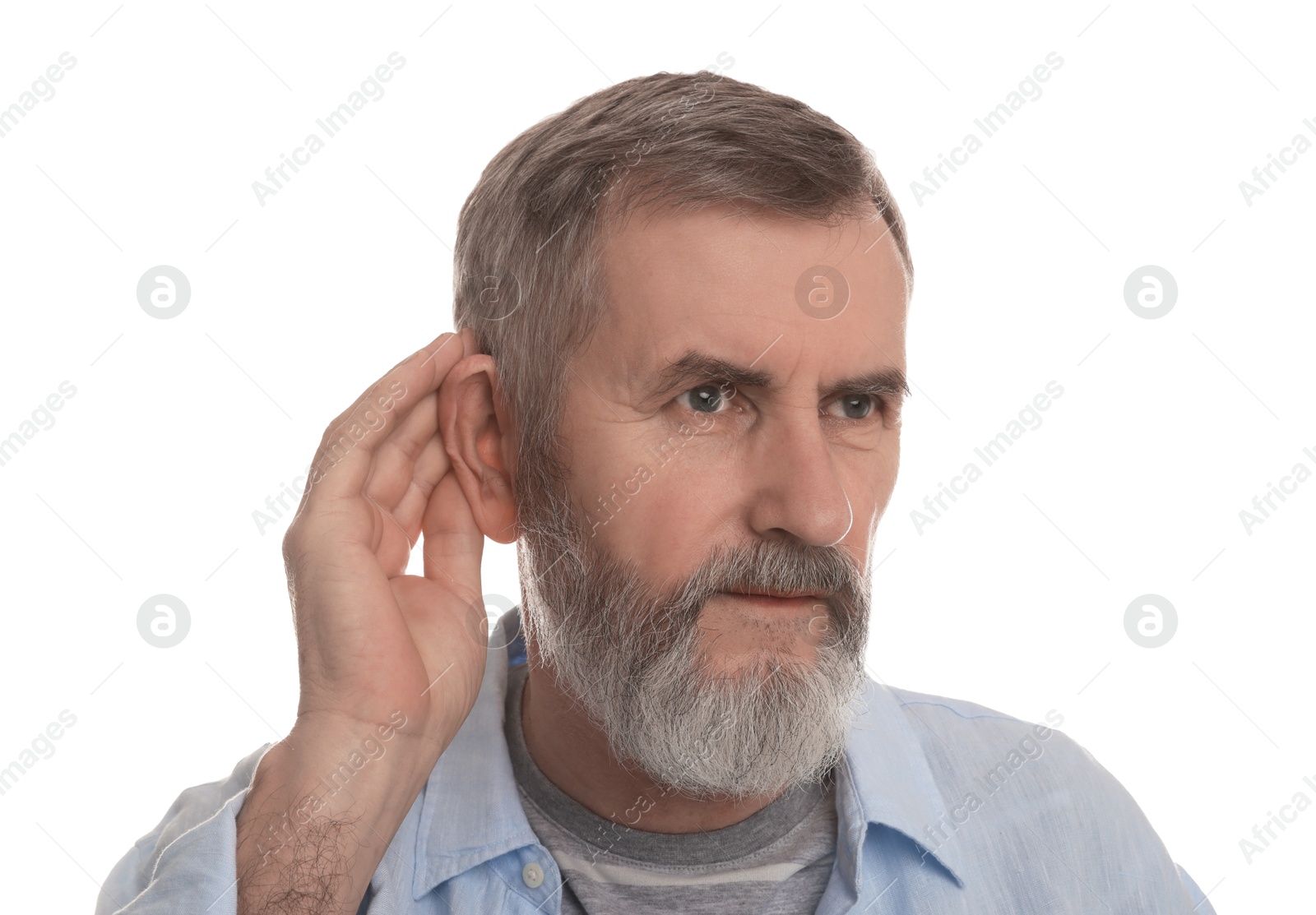 Photo of Senior man showing hand to ear gesture on white background