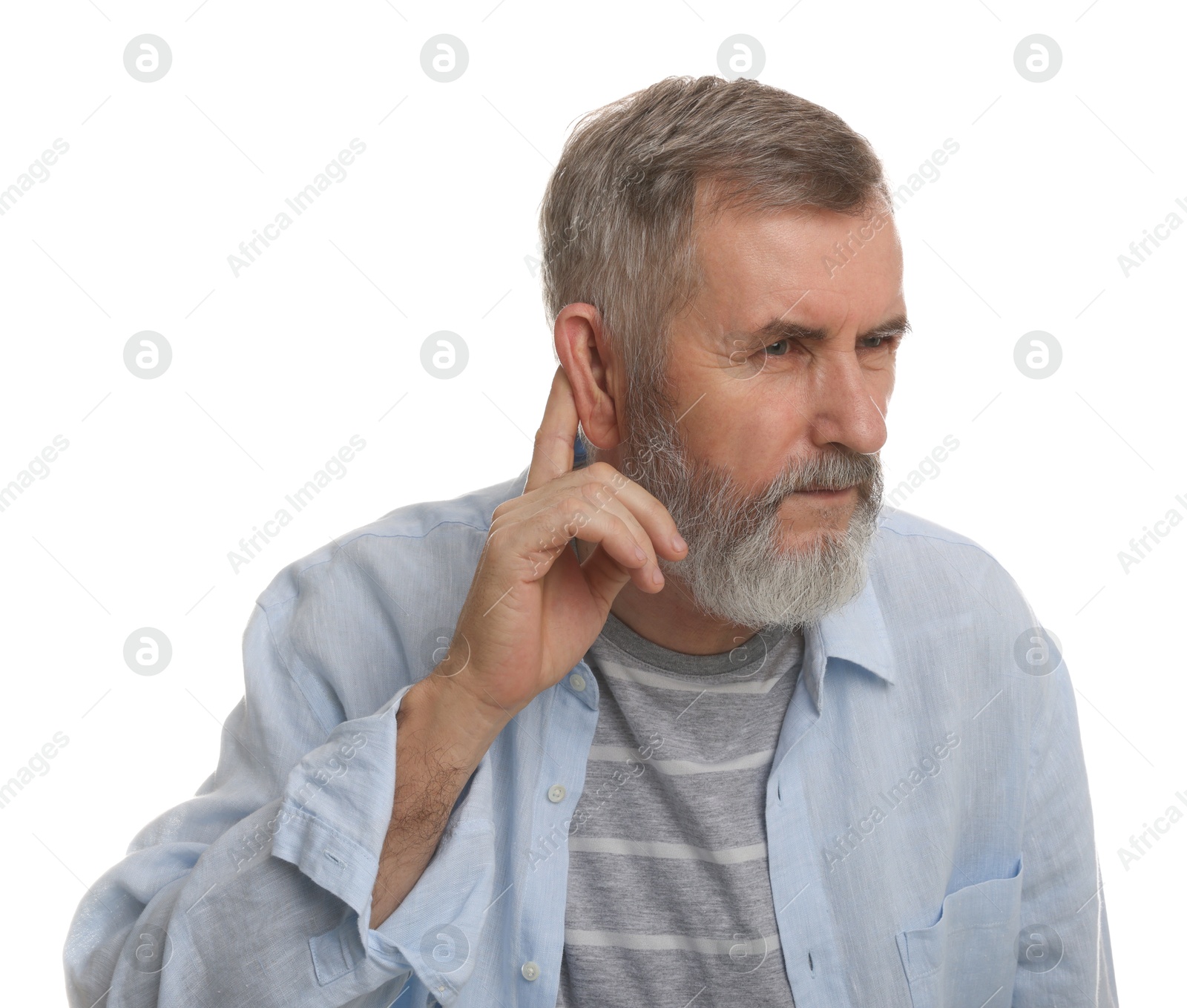 Photo of Senior man showing hand to ear gesture on white background