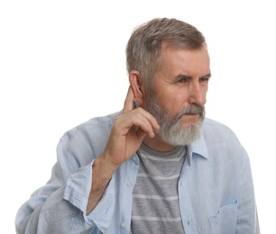 Photo of Senior man showing hand to ear gesture on white background