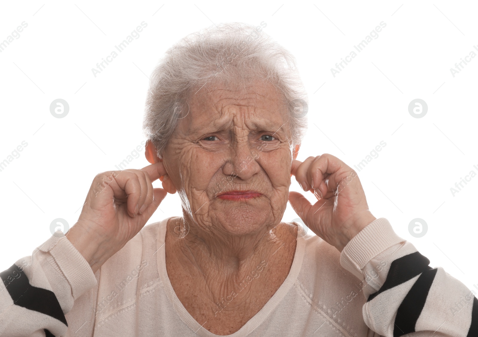 Photo of Senior woman covering her ears with fingers on white background