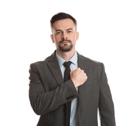 Photo of Man making promise on white background. Oath gesture