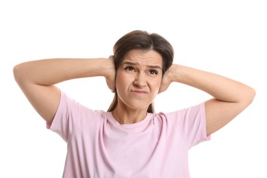 Photo of Woman covering her ears on white background