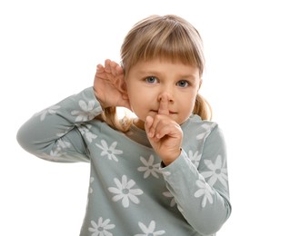 Photo of Little girl showing hand to ear gesture on white background