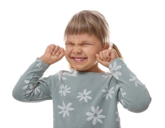 Photo of Little girl covering her ears with fingers on white background