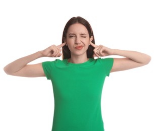 Photo of Woman covering her ears with fingers on white background