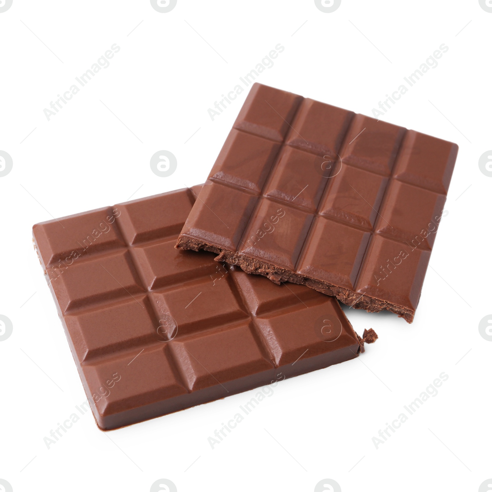 Photo of Pieces of delicious milk chocolate isolated on white