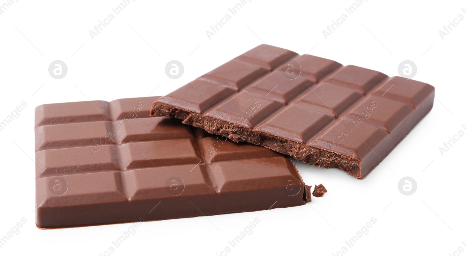 Photo of Pieces of delicious milk chocolate isolated on white