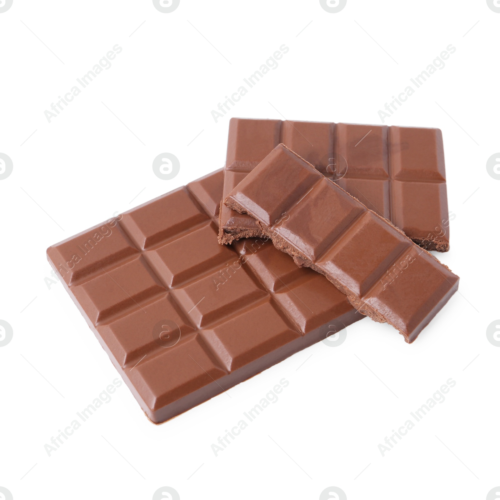 Photo of Pieces of delicious milk chocolate isolated on white