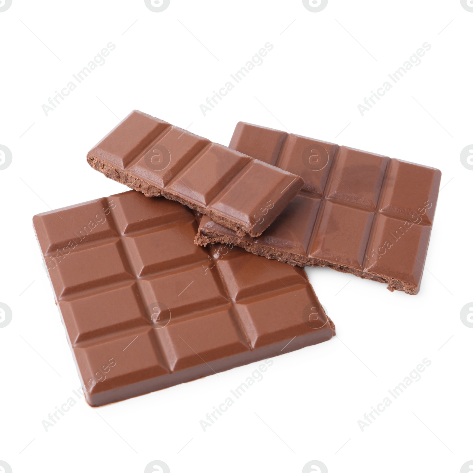 Photo of Pieces of delicious milk chocolate isolated on white