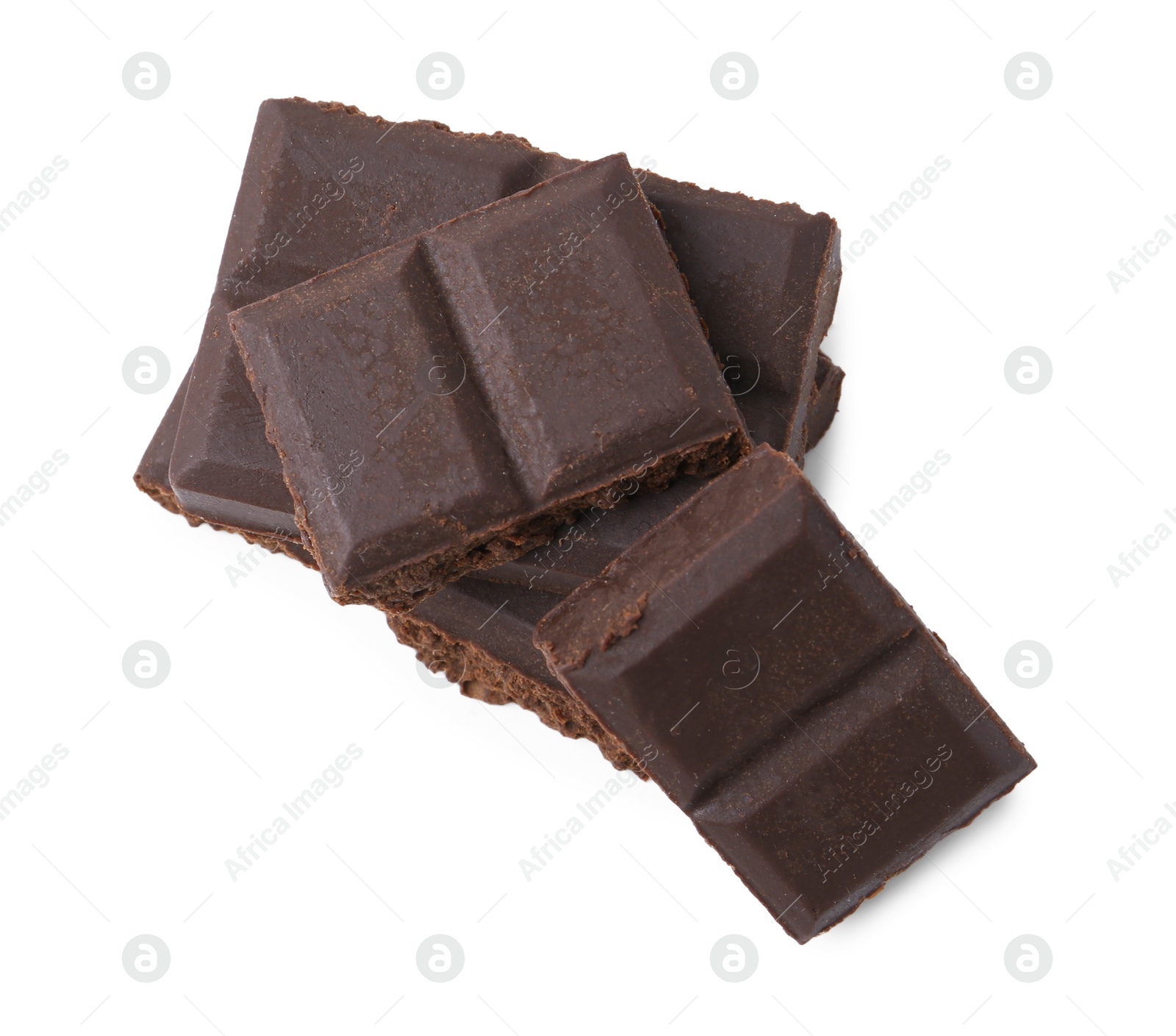 Photo of Pieces of delicious dark chocolate isolated on white, top view