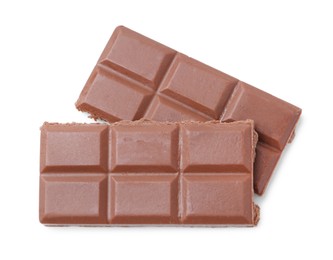 Photo of Pieces of delicious milk chocolate isolated on white, top view