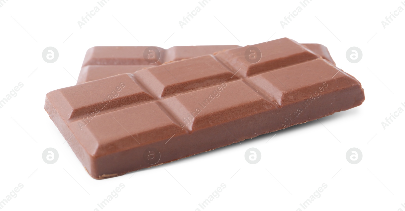 Photo of Pieces of delicious milk chocolate isolated on white