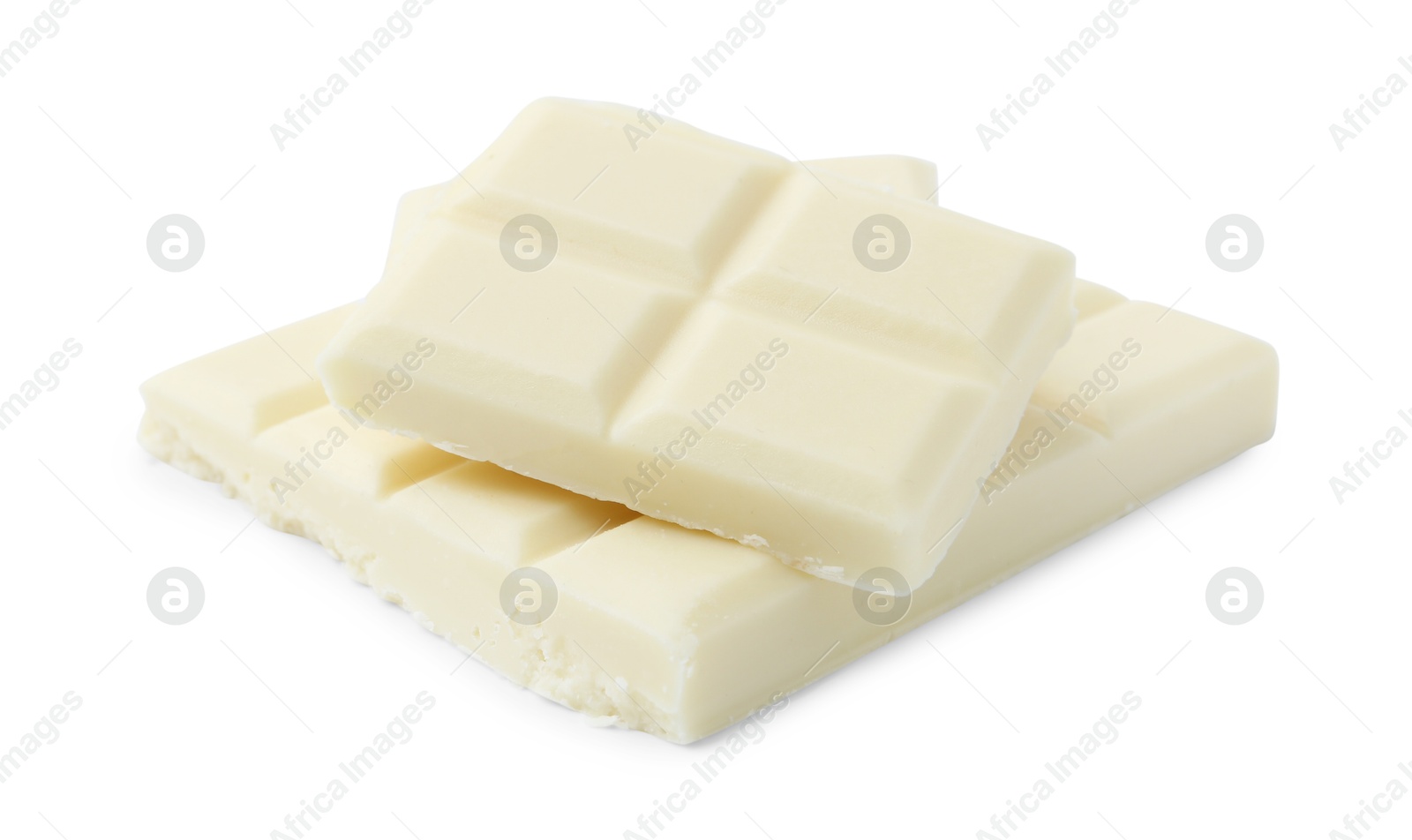 Photo of Pieces of delicious white chocolate isolated on white