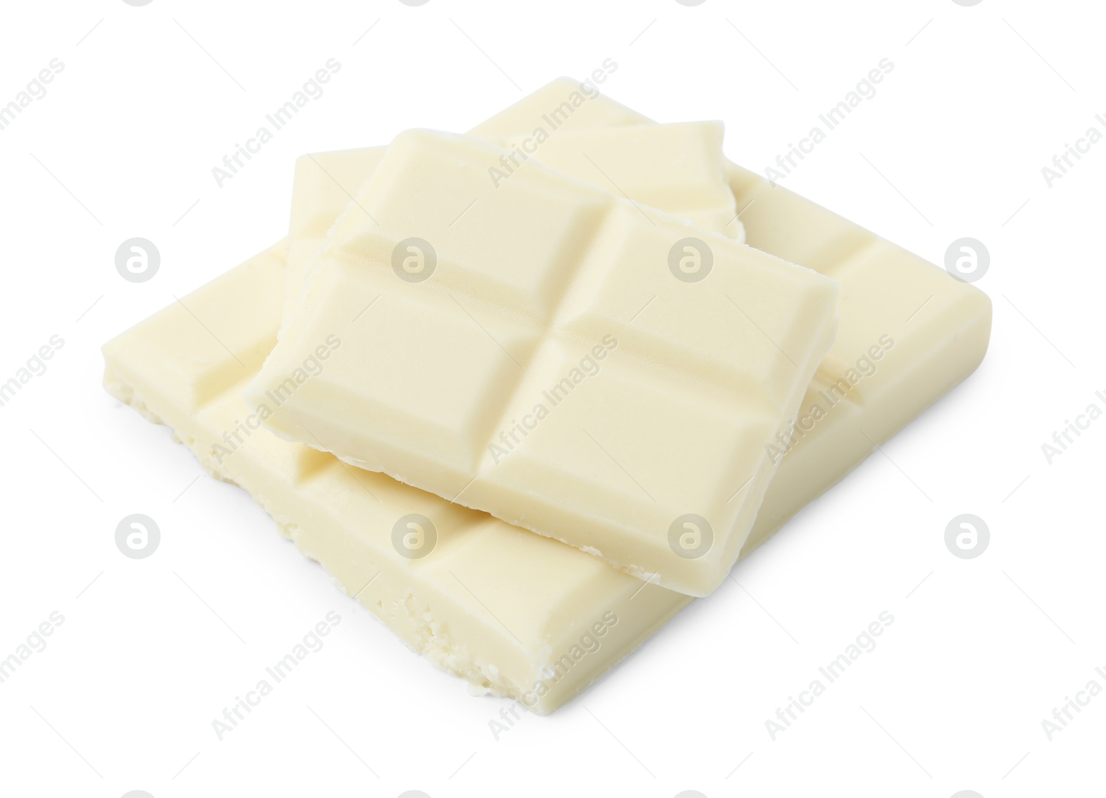 Photo of Pieces of delicious white chocolate isolated on white