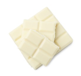 Pieces of delicious white chocolate isolated on white, top view