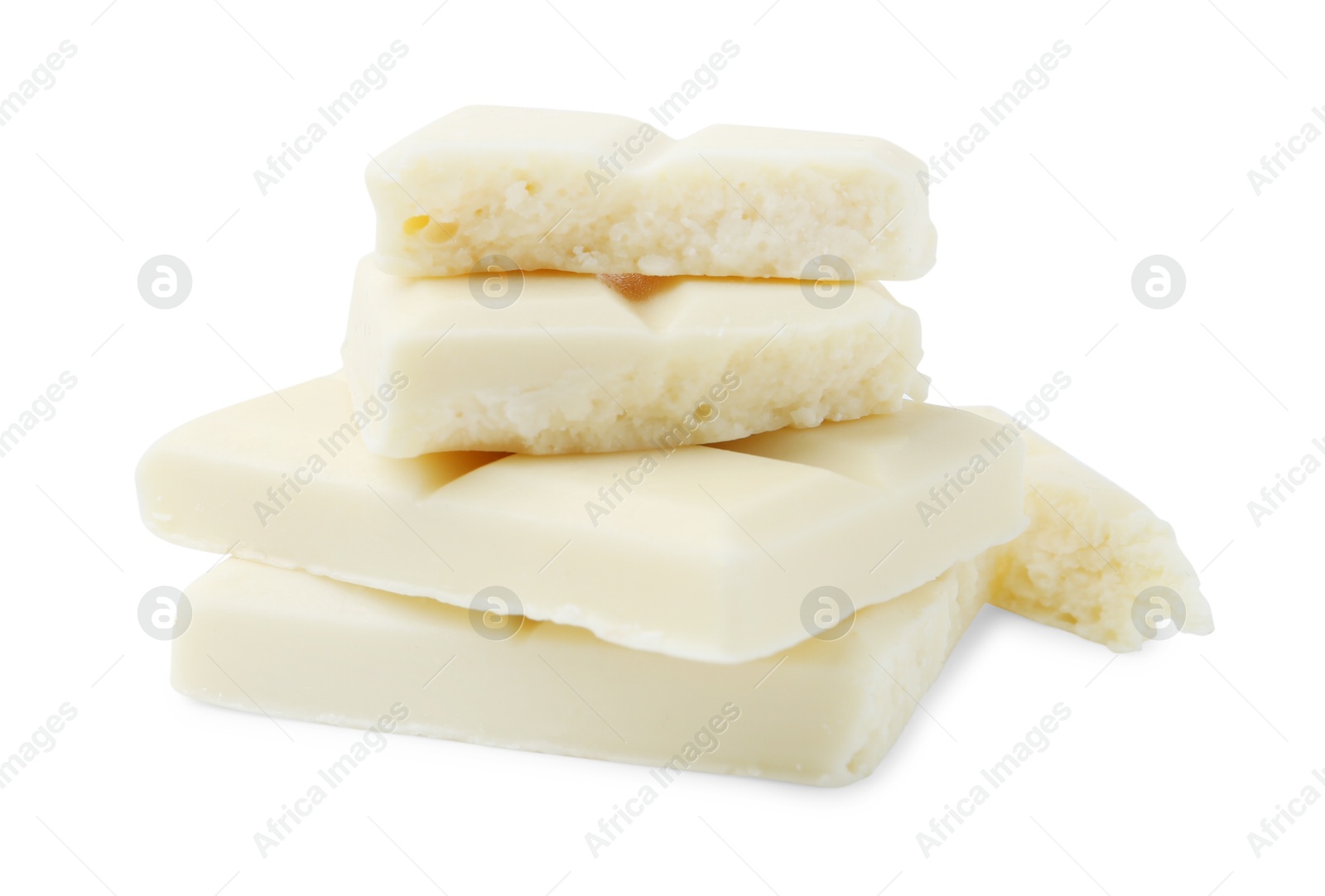 Photo of Pieces of delicious white chocolate isolated on white