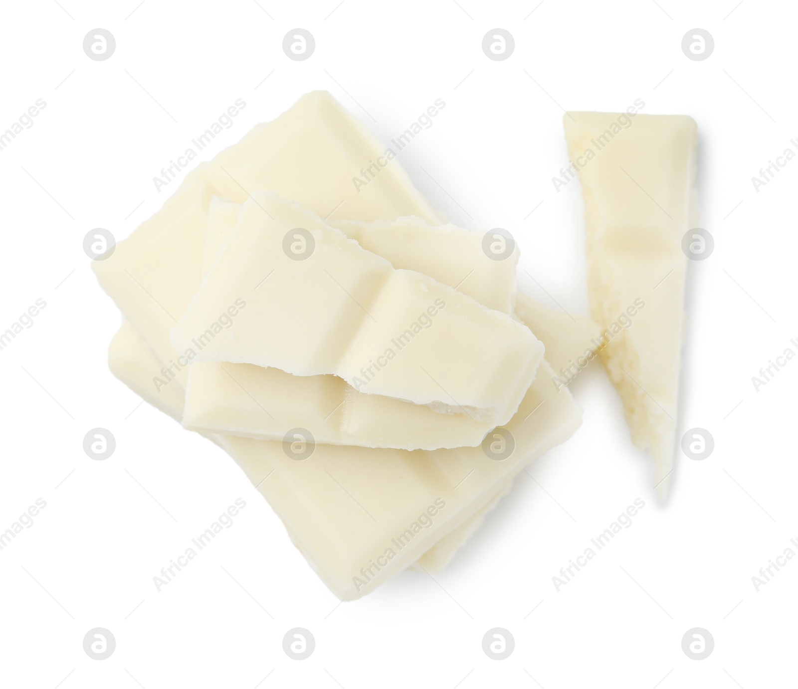 Photo of Pieces of delicious white chocolate isolated on white, top view