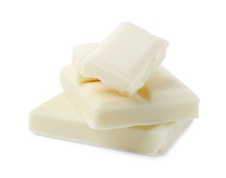 Photo of Pieces of delicious white chocolate isolated on white