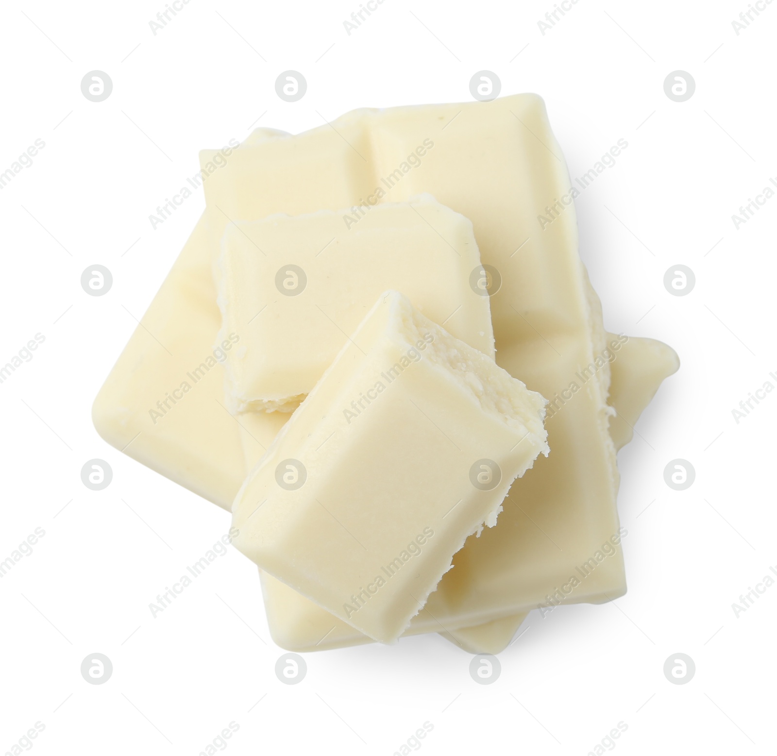 Photo of Pieces of delicious white chocolate isolated on white, top view