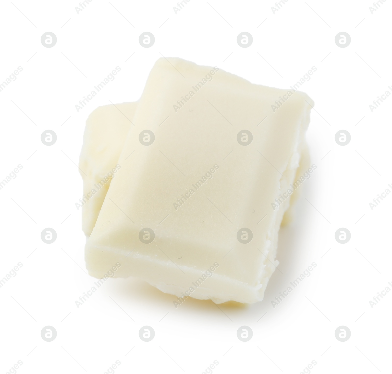 Photo of Pieces of delicious white chocolate isolated on white