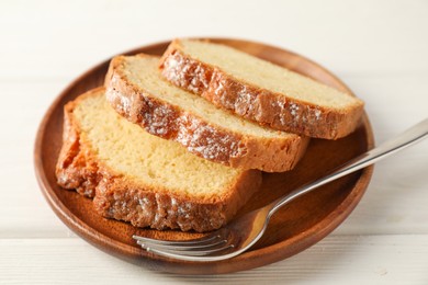 Photo of Freshly baked sponge cake on white wooden table, closeup