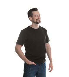 Photo of Man in blank black t-shirt on white background. Mockup for design