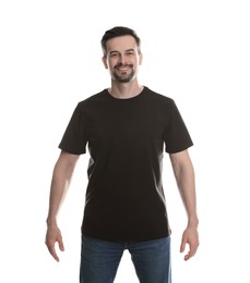 Photo of Man in blank black t-shirt on white background. Mockup for design