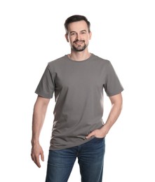 Photo of Man in blank grey t-shirt on white background. Mockup for design