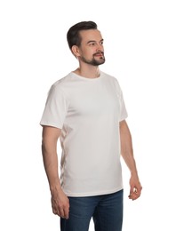 Photo of Man in blank t-shirt on white background. Mockup for design