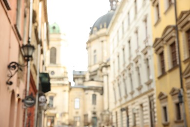 Photo of Blurred view of beautiful buildings on city street, low angle view