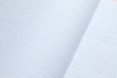 Photo of Copybook paper sheets as background, closeup. School stationery