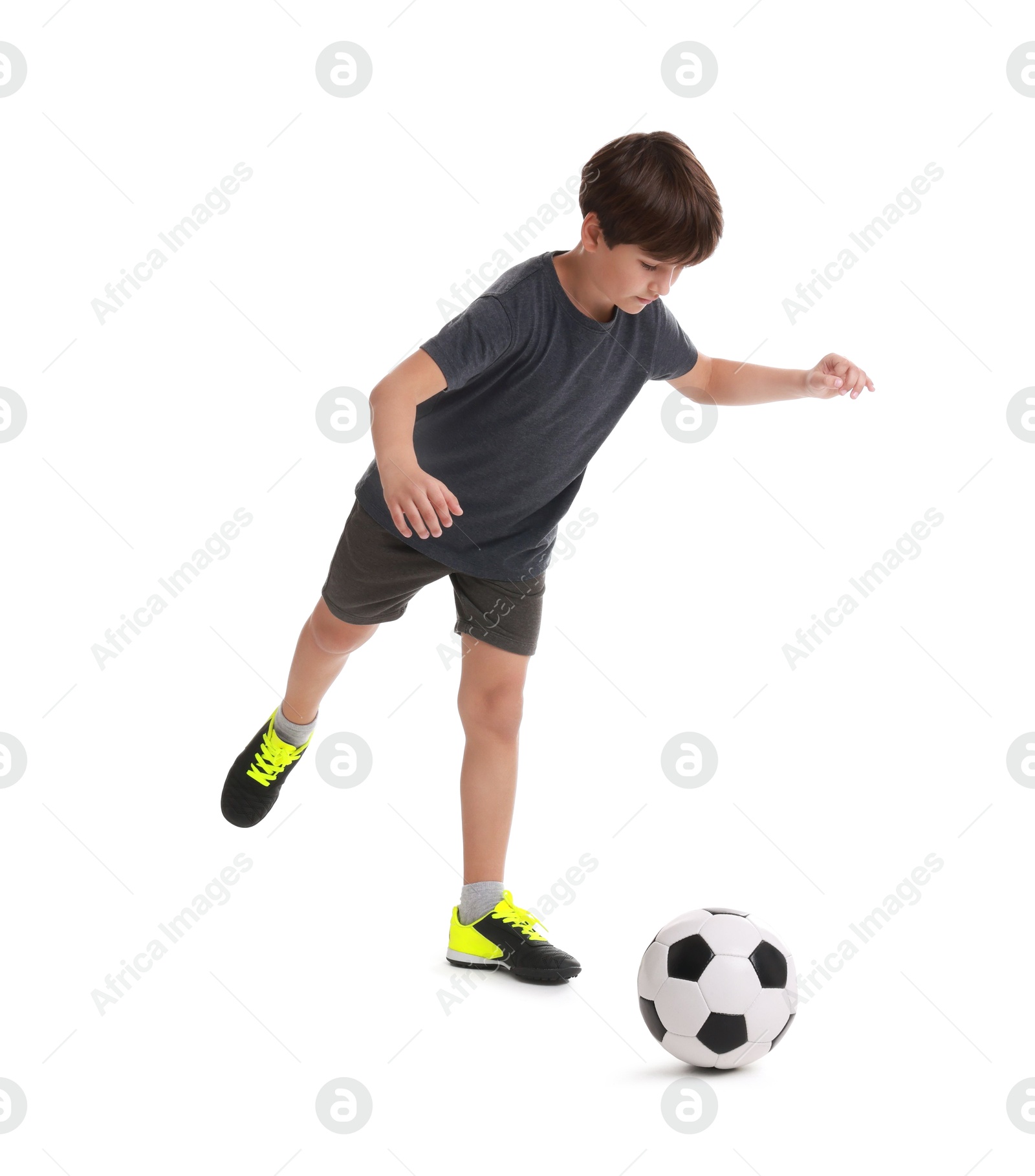 Photo of Boy with soccer ball playing football on white background