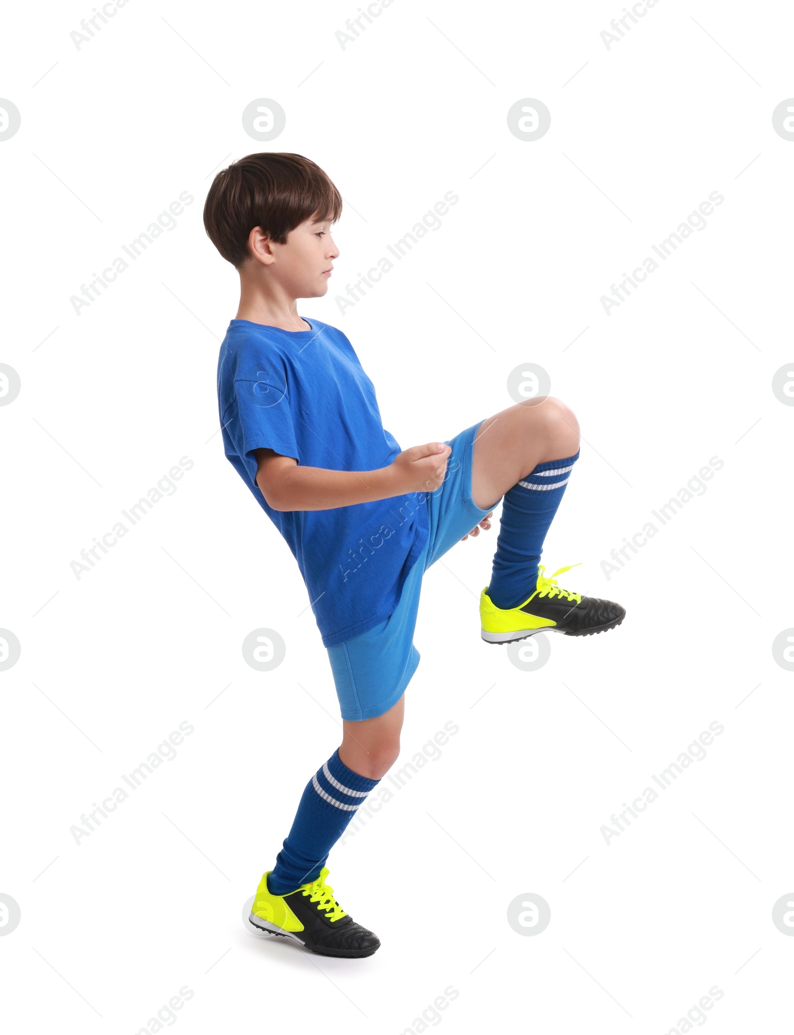 Photo of Boy with soccer ball playing football on white background