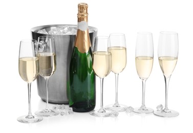 Photo of Champagne and bucket with ice isolated on white