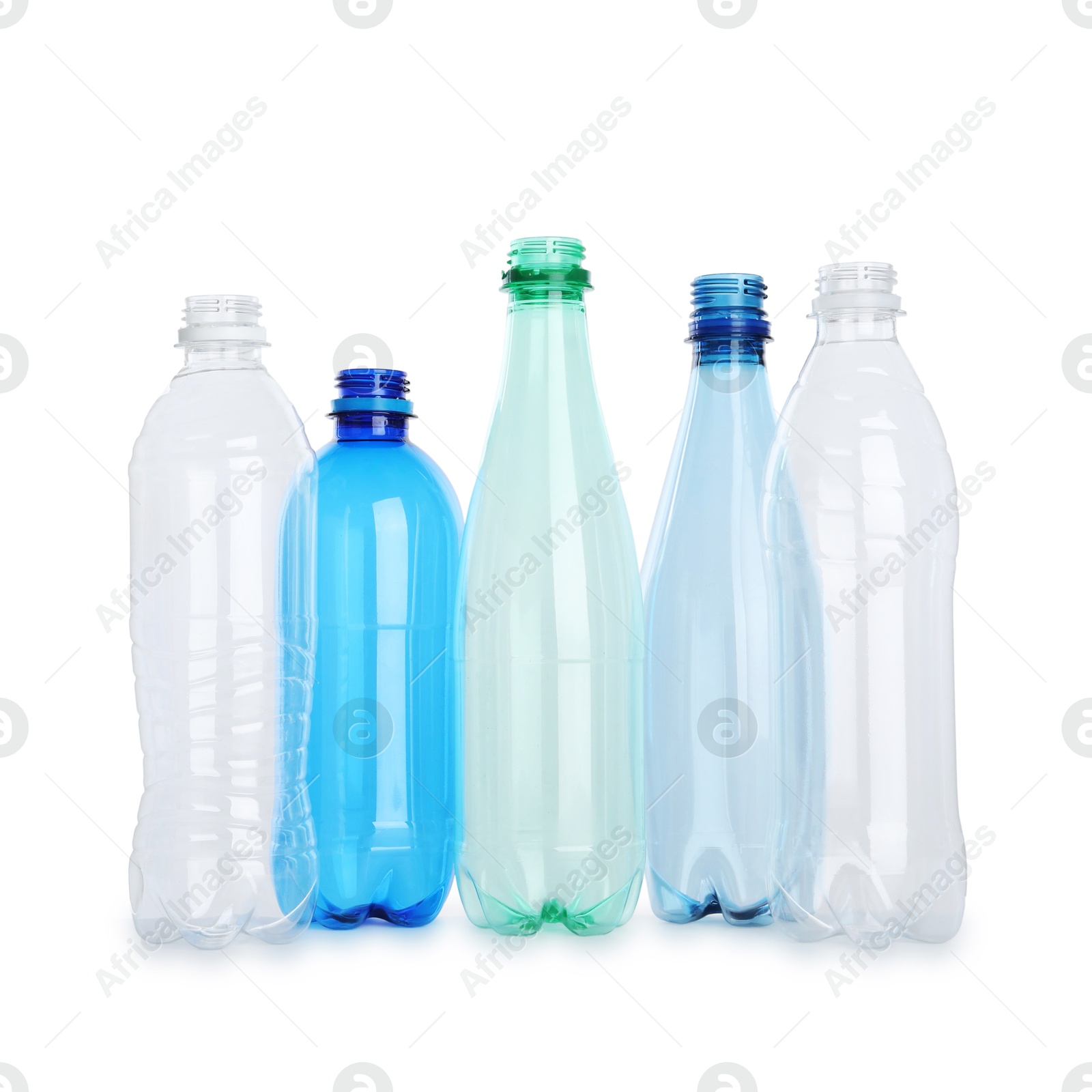 Photo of Many empty plastic bottles isolated on white