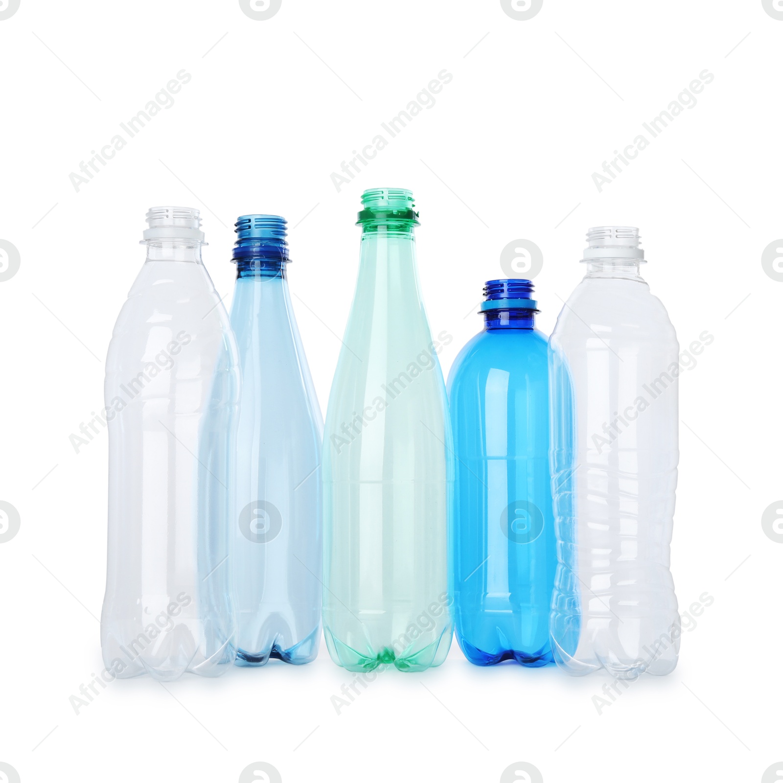 Photo of Many empty plastic bottles isolated on white