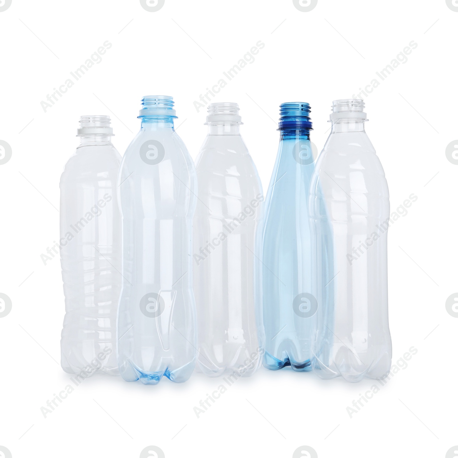 Photo of Many empty plastic bottles isolated on white