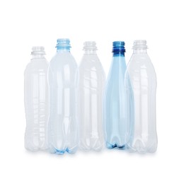 Photo of Many empty plastic bottles isolated on white