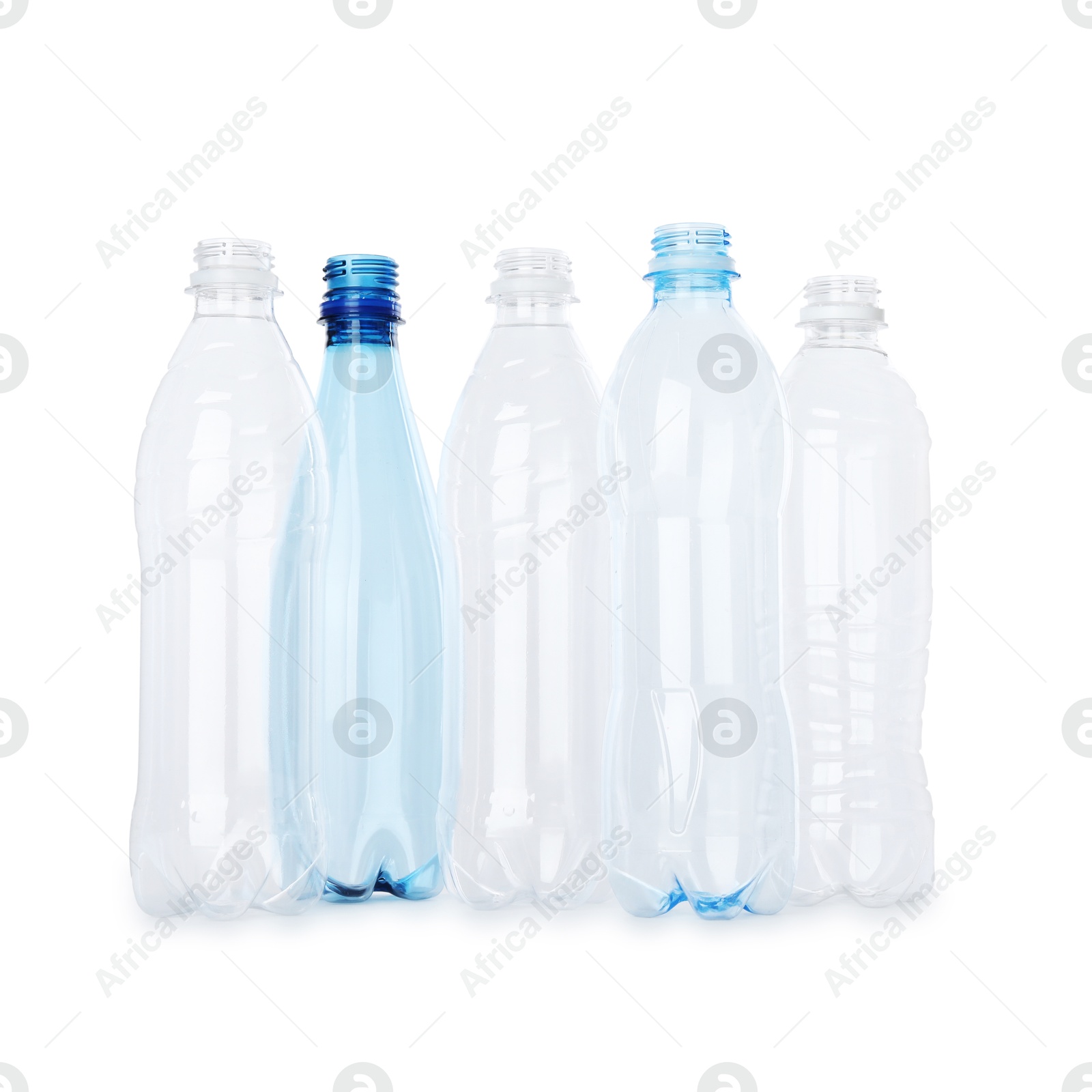 Photo of Many empty plastic bottles isolated on white