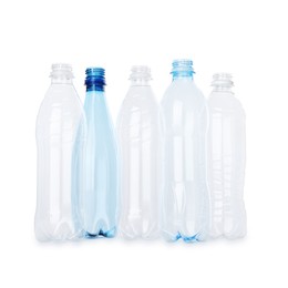 Photo of Many empty plastic bottles isolated on white