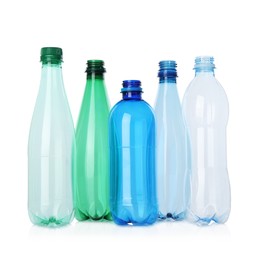 Photo of Many empty plastic bottles isolated on white