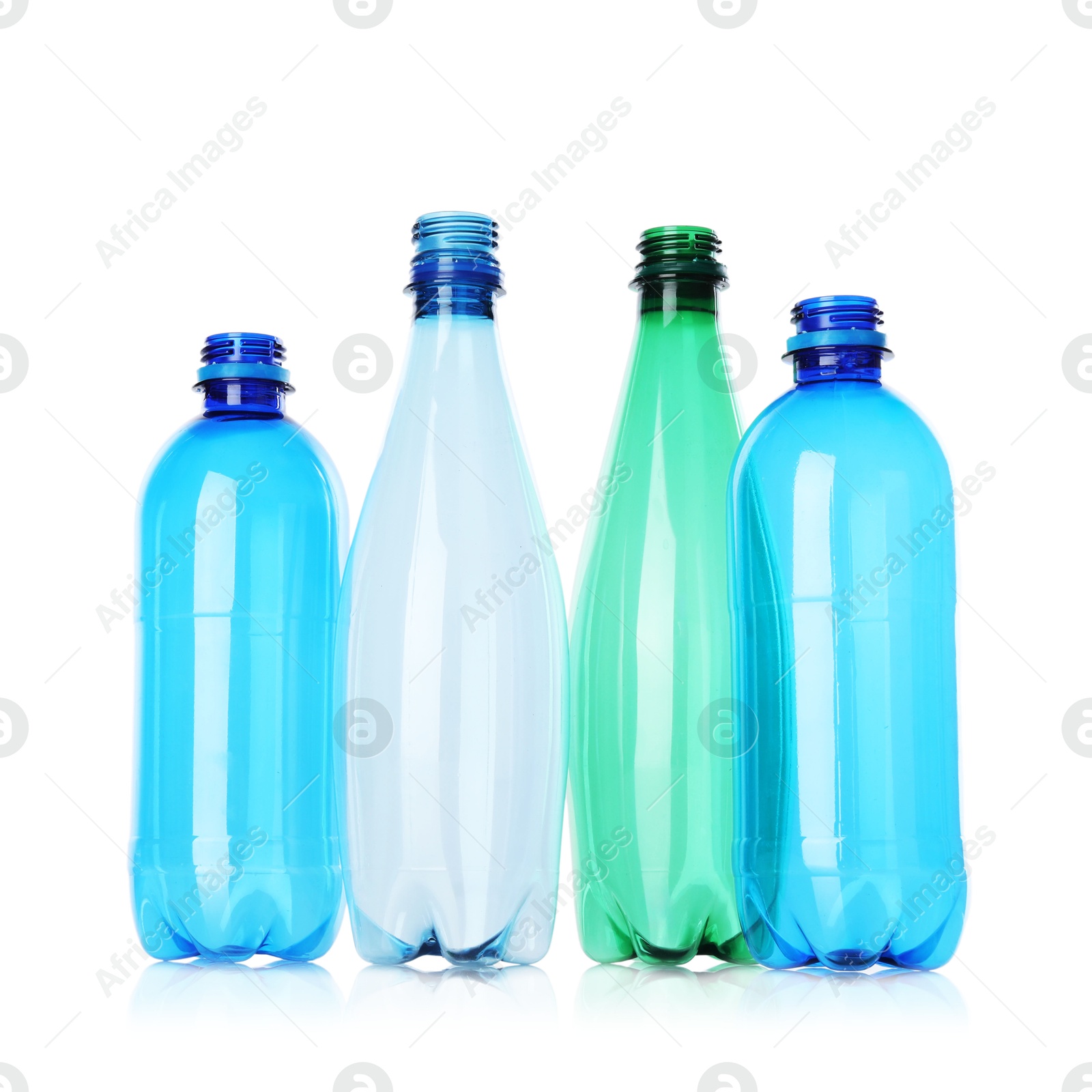 Photo of Many empty plastic bottles isolated on white