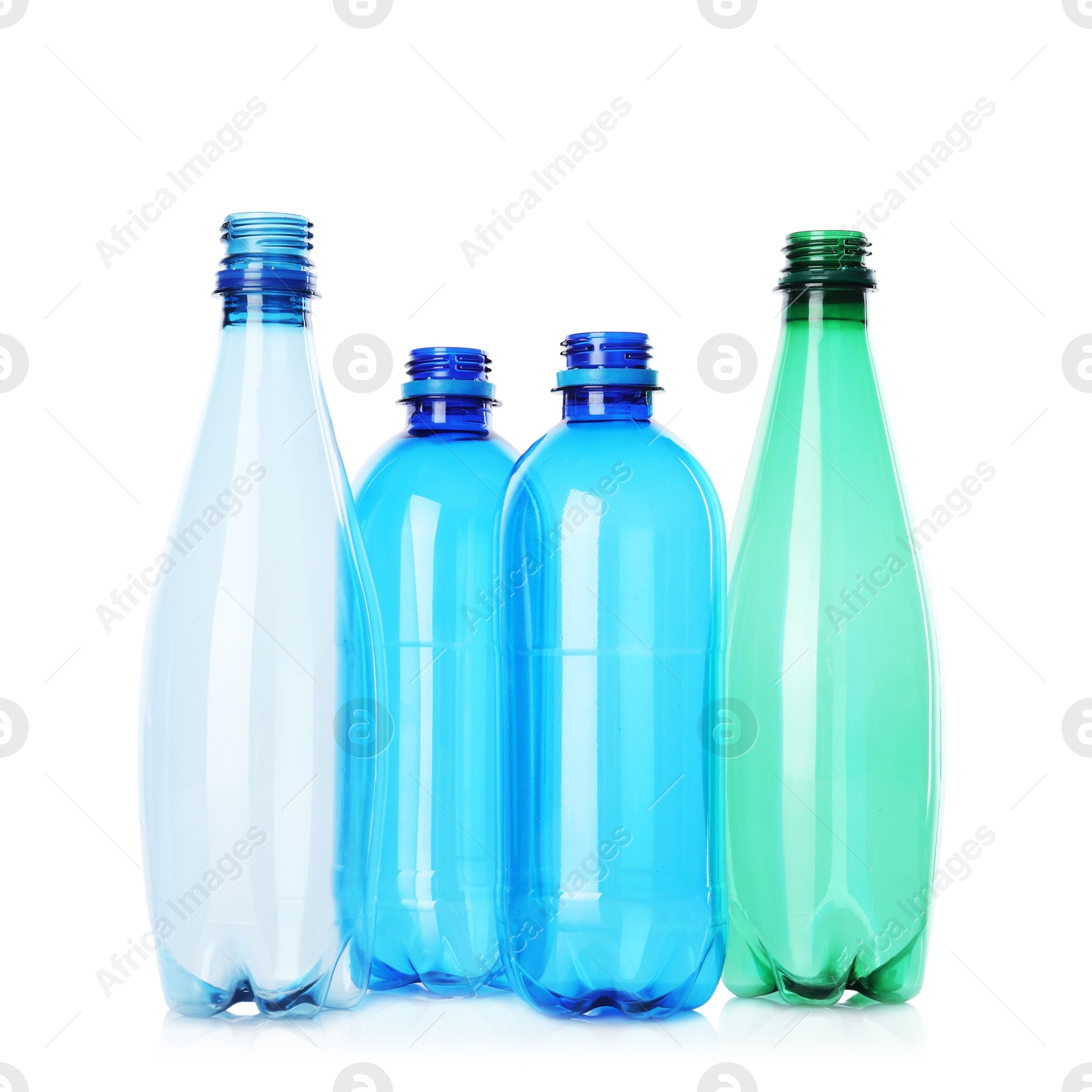 Photo of Many empty plastic bottles isolated on white