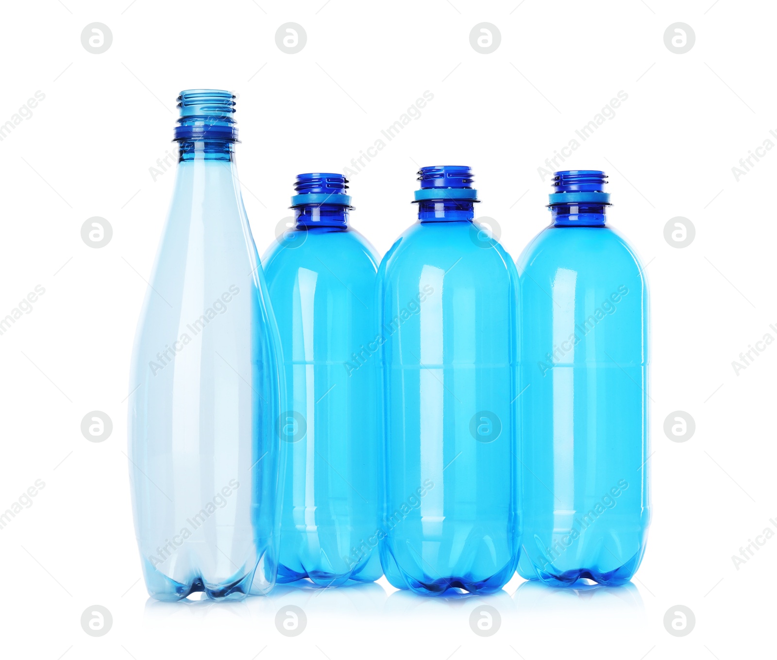 Photo of Many empty plastic bottles isolated on white