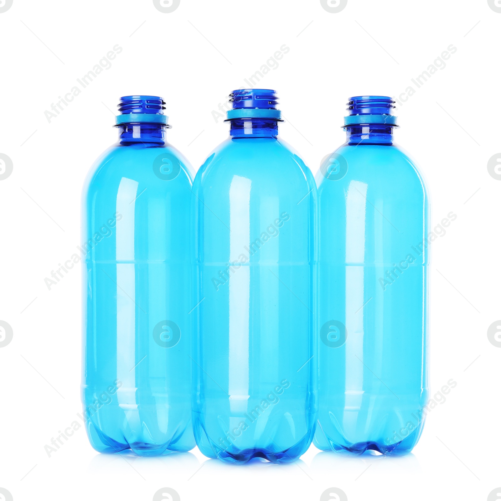 Photo of Many empty plastic bottles isolated on white